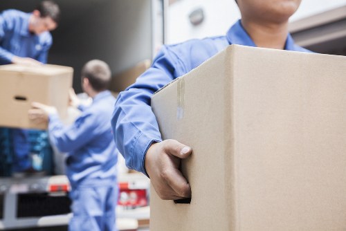 Flat removals in Brixton with moving van and packed boxes