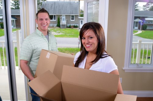 Expert packers handling fragile household items in Brixton