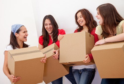 Office removals planning in Brixton with moving boxes and workspace setup